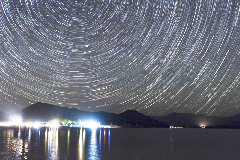The caravan park on the lake's edge and southern celestial pole above, captured at Lake Moogerah, 49 x 30 sec exposures stacked.